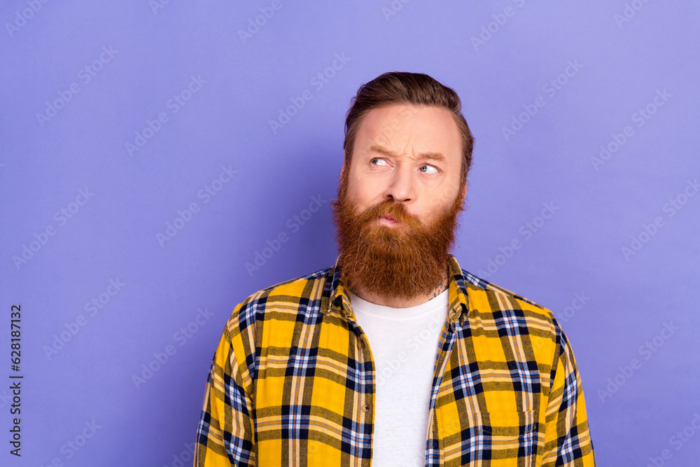 Photo of minded person look interested empty space contemplate hesitate isolated on violet color background Photo of minded person look interested empty space contemplate hesitate isolated on violet color background