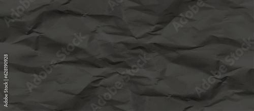 Black creased crumpled paper texture can be use as background. Ragged black Paper. black waxed packing paper texture.	
