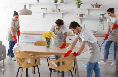 Young janitors cleaning in ...