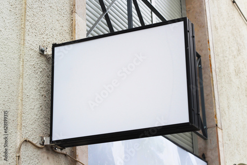 Storefront light box sign, shop, cafe, restaurant mounted signboard mock up design template. Blank white store sign design mockup.