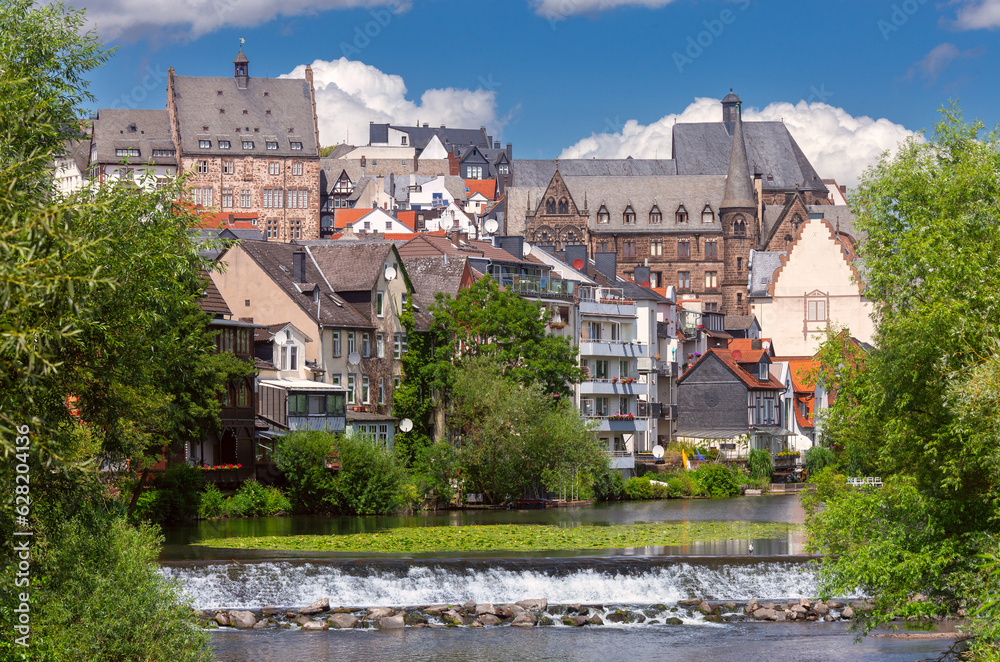 Old stone houses on the banks of the river Lahn in Marburg.