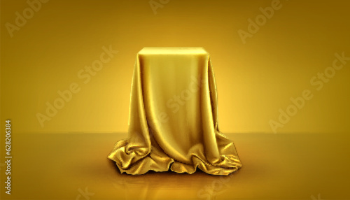 Realistic square podium covered with golden silk cloth. Vector illustration of surprise gift box hidden under satin fabric curtain with drapery waves, yellow studio background. Grand presentation