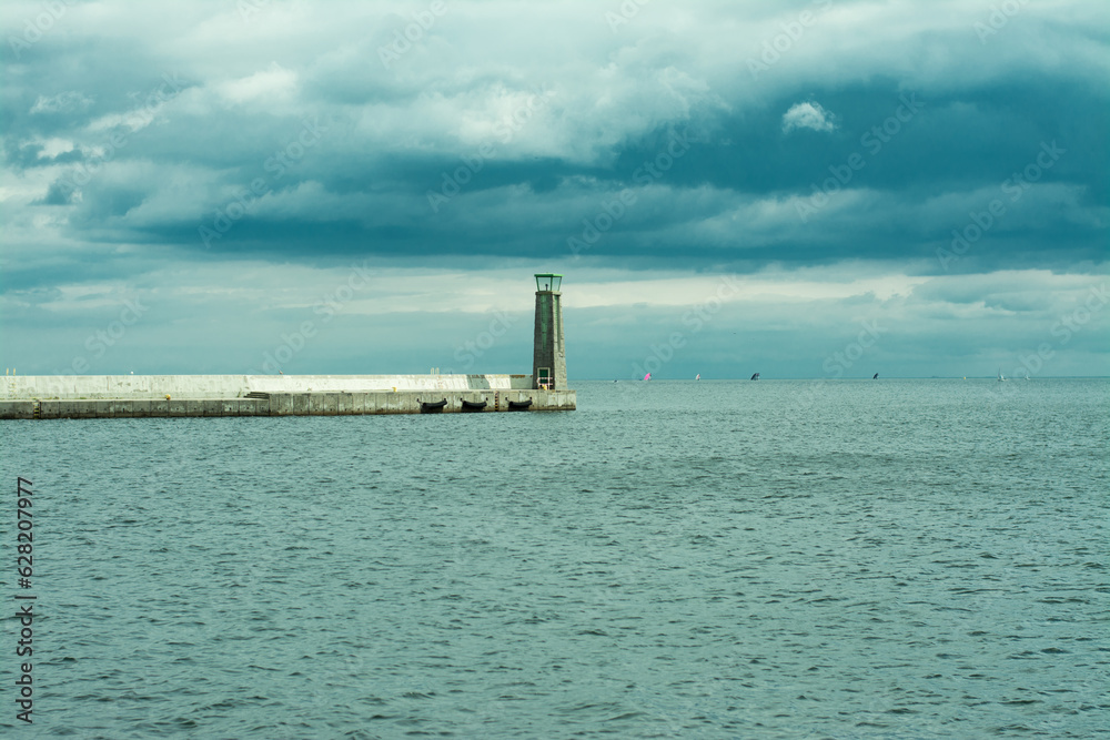 Lighthouse in Gdynia on the Baltic Sea in cloudy weather