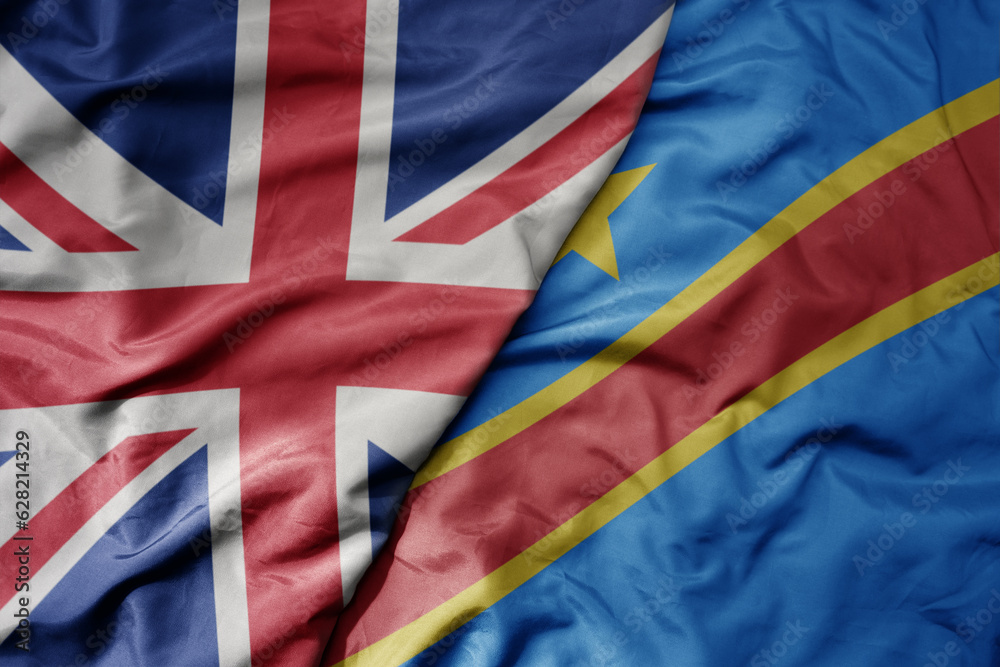 big waving national colorful flag of great britain and national flag of democratic republic of the congo . big waving national colorful flag of great britain and national flag of democratic republic of the congo .