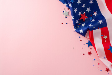 Celebrate Labor Day with a feminine touch. High-angle shot of a pink isolated background showcasing an American flag decorated with shimmering confetti stars. Ideal for text or ads