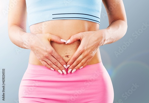 Wallpaper Mural Heart shape from hand of young woman on stomach Torontodigital.ca