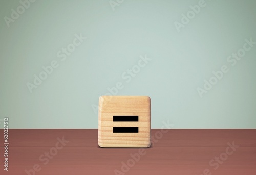 Equally symbol on wooden cube block.