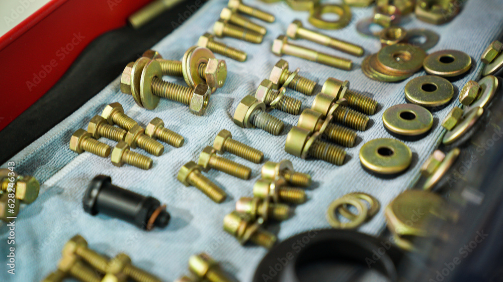 A large number of bolts laid out on the table A large number of bolts laid out on the table