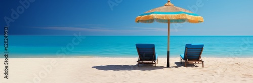 Minimalistic vocation concept. Sun beds on golden sand and turquoise sea water