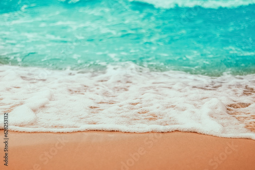 Fototapeta Naklejka Na Ścianę i Meble -  Soft Blue ocean wave on sandy beach. tropical white sand With the sea at the corner.