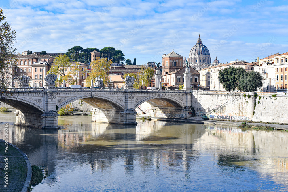Rome, Italy - 26 Nov, 2022: View of St. Peter's Basilica and bridges over the Tiber river