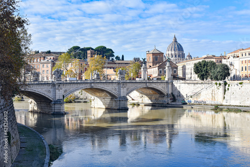 Rome, Italy - 26 Nov, 2022: View of St. Peter's Basilica and bridges over the Tiber river