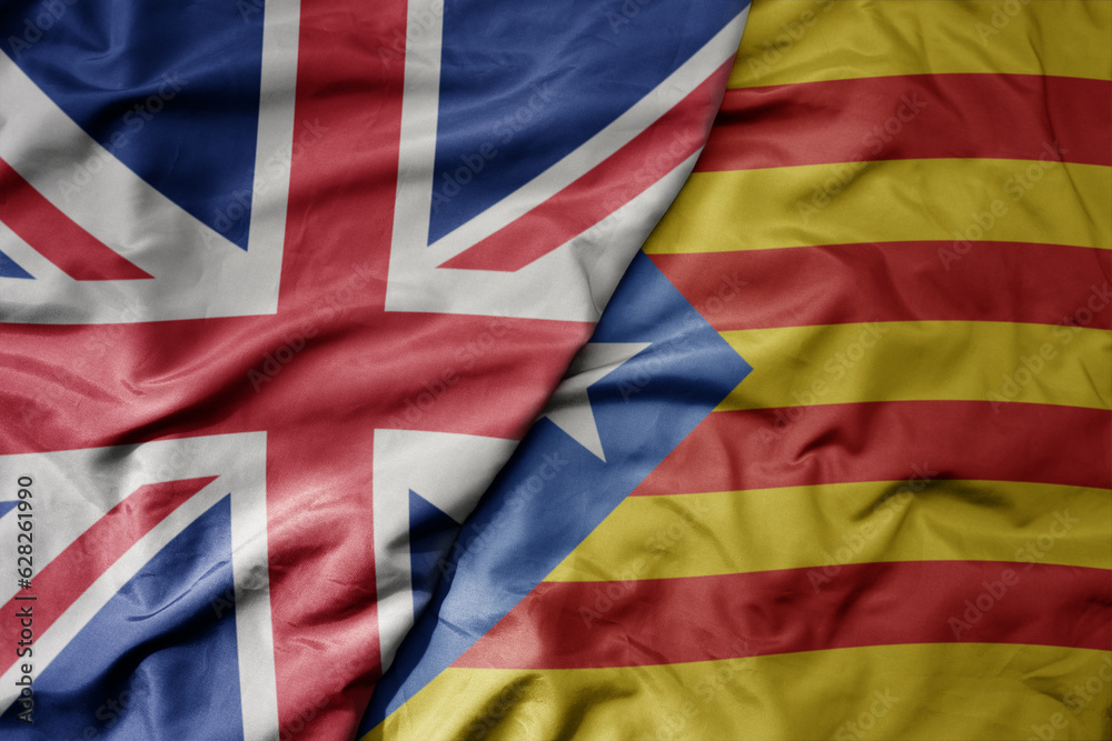 big waving national colorful flag of great britain and national flag of catalonia . big waving national colorful flag of great britain and national flag of catalonia .