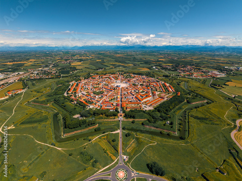 Palmanova is an Italian town what  founded in 1593, features a unique star-shaped layout with well-preserved Renaissance architecture and historic charm.