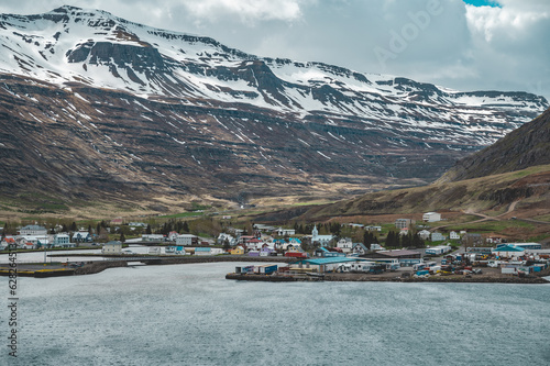 Cityscape of Seyoisfjorour in Island during Springtime, view from the sea