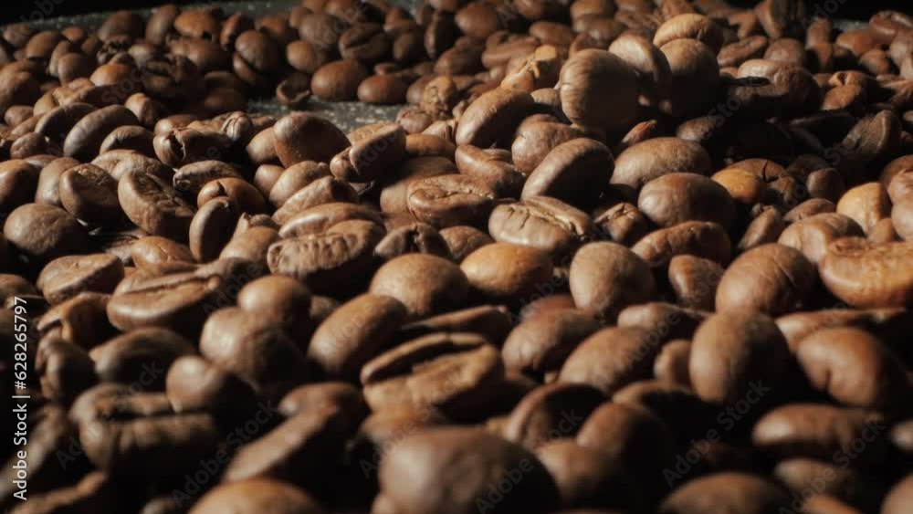 Roasting coffee close up. Macro shot of seeds of coffee. Coffee beans slow motion. Roasting coffee close up. Macro shot of seeds of coffee. Coffee beans slow motion.