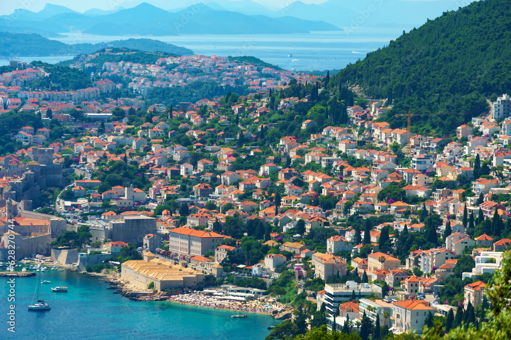 aerial view of the fortress and old city on the seashore and mountains, panorama of the resorts of Dubrovnik in Croatia, Adriatic sea, beaches, islands, tourism and summer traveling