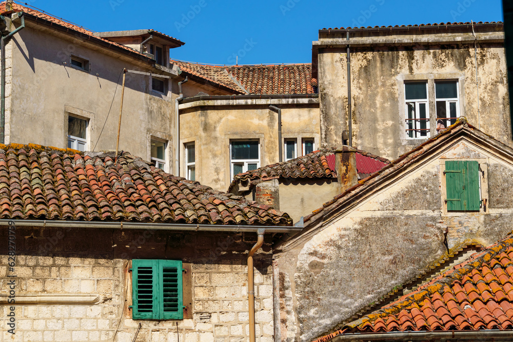 street view of the old town of Kotor in Montenegro, medieval European architecture, city streets, red tiled roofs, the concept of traveling across the Balkans