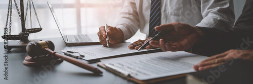 Businessmen or lawyers working together at a meeting, teamwork and partnership. Signing documents, contracts, checking details business agreement photo