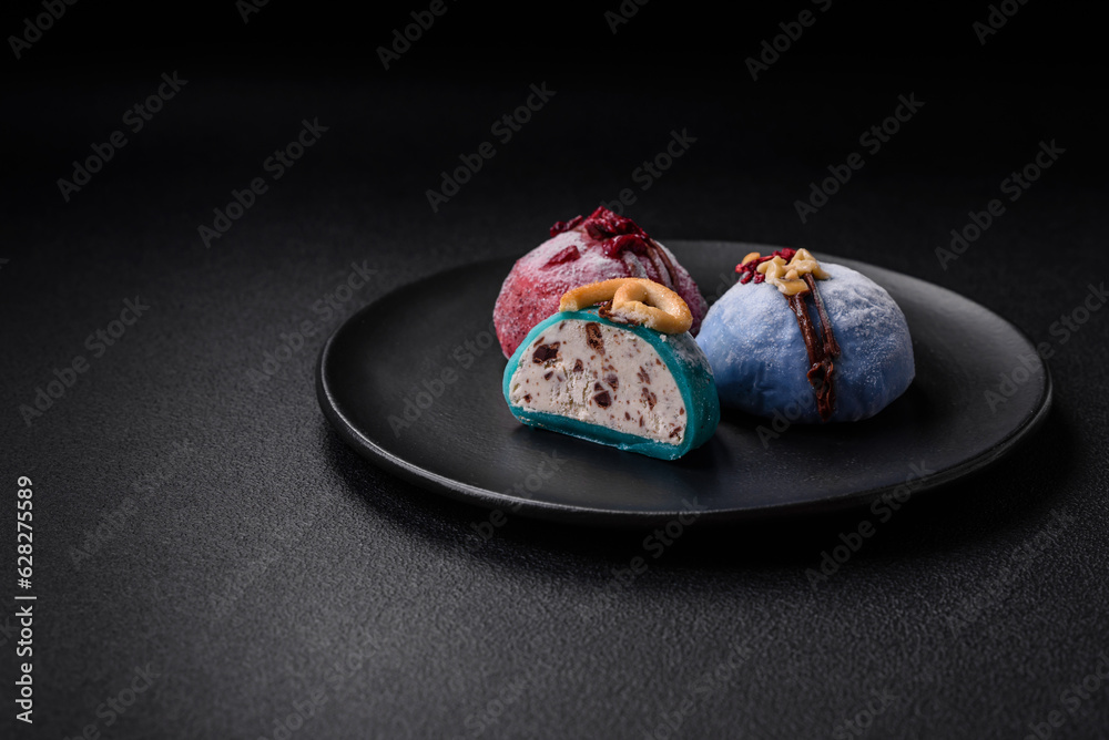 Delicious sweet colorful mochi desserts or ice cream with rice dough and toppings