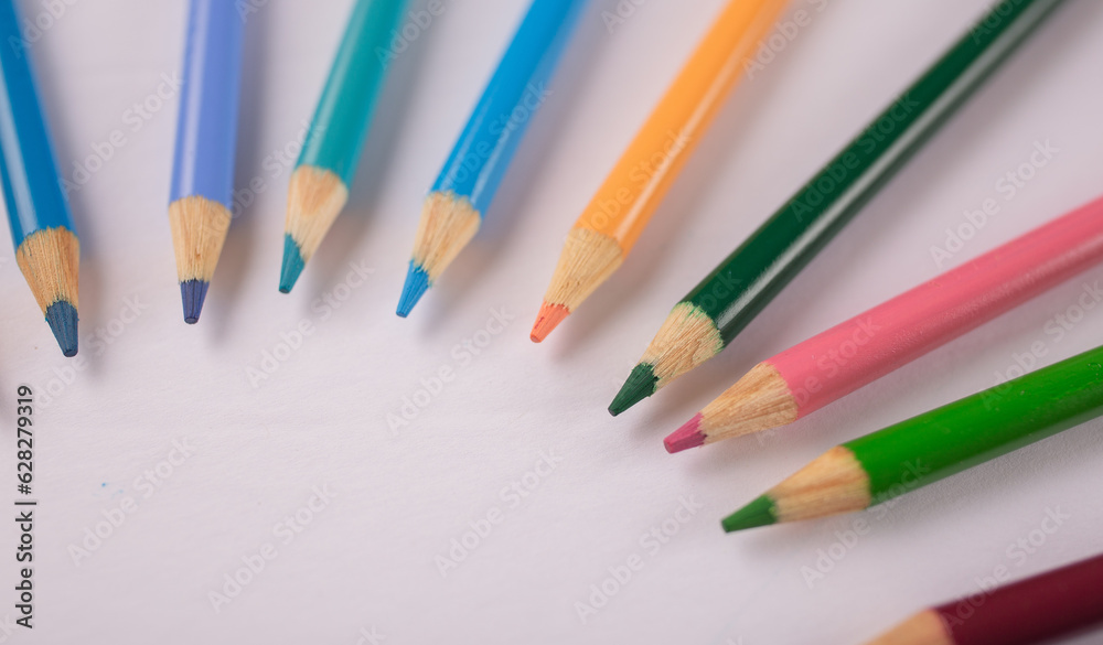 Fototapeta premium colored pencils in a circular design artwork
