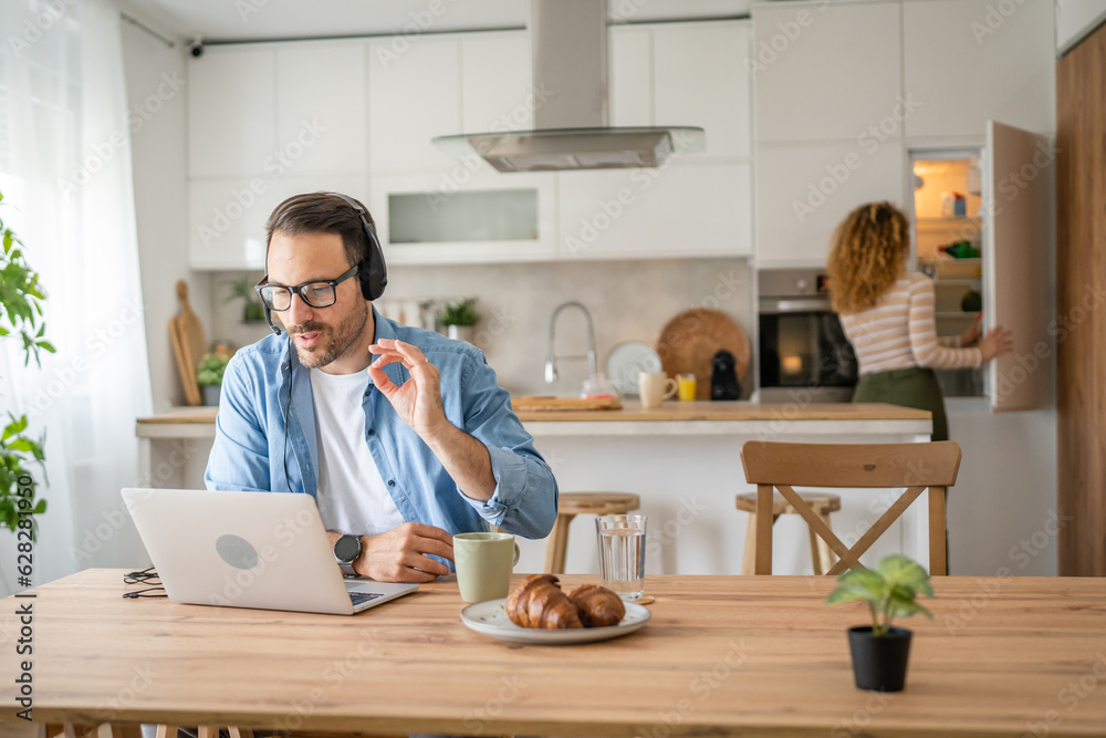 One man caucasian male freelancer work from home on laptop computer One man caucasian male freelancer work from home on laptop computer
