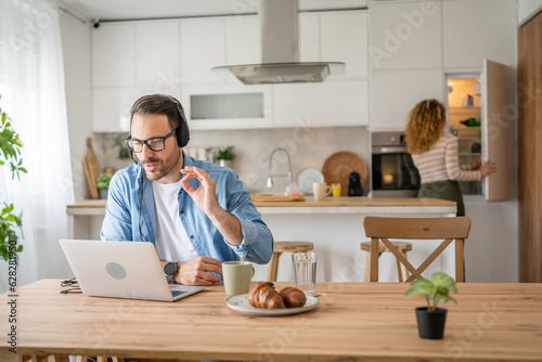 One man caucasian male freelancer work from home on laptop computer