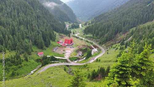 Beautiful view of Romanian Transfagarasan Road crosssing the Carpahtian Mountains, breathtaking landscape over the hairpins of the national road, high altitude in cloudy weather photo