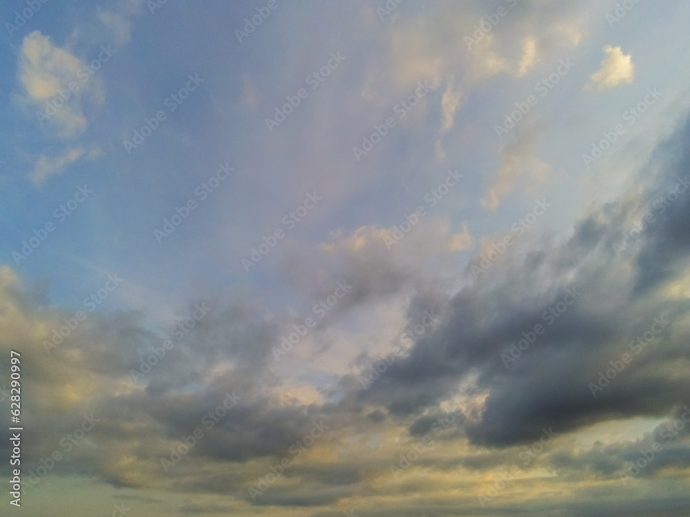 Blue sky with different shape clouds. Nature background for design. Paradise concept.