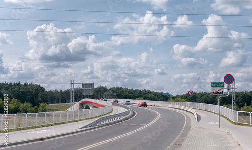 New concrete bridge for cars over Warta river (Most w Rogalinku). Rogalinek and Mosina border, Wielkopolska, Poland - July 2023.