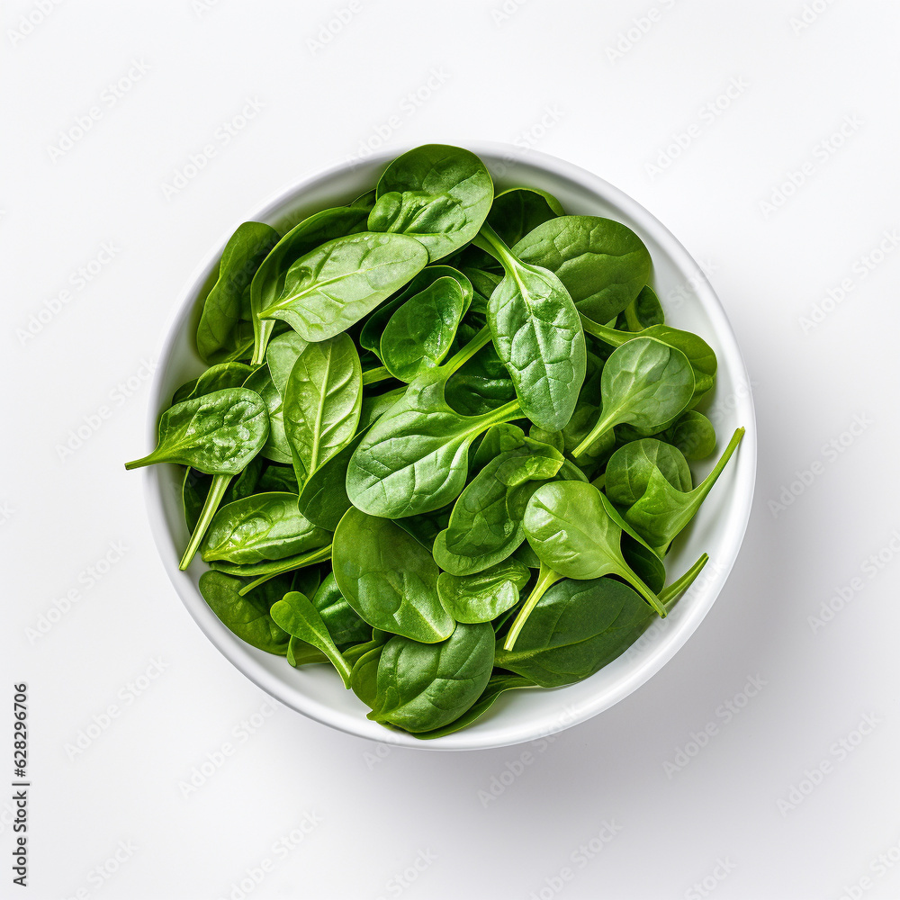 Top-down view of a bowl of baby spinach. Top-down view of a bowl of baby spinach.