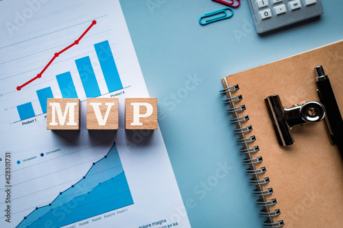 There is wood cube with the word MVP. It is an abbreviation for Minimum Viable Product as eye-catching image.