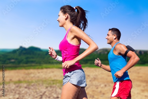 Happy young couple running together