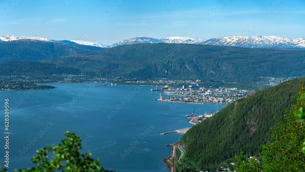Panorama over Mo i Rana, Helgeland, Norway from Hauknestinden, 800 meters over sea level at Hauknes, next to Ranfjorden. Rana port with Rana gruber inbetween the norwegian mountains during summer