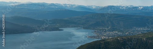 Panorama over Mo i Rana, Helgeland, Norway from Hauknestinden, 800 meters over sea level at Hauknes, next to Ranfjorden. Rana port with Rana gruber inbetween the norwegian mountains during summer