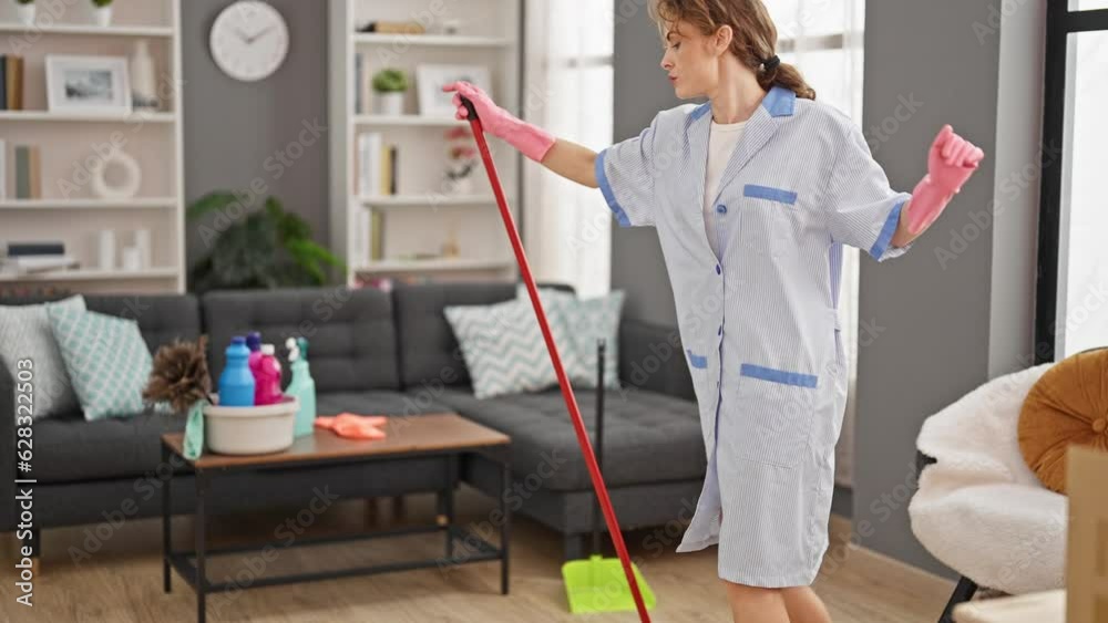 Young woman professional cleaner dancing and cleaning floor at home Young woman professional cleaner dancing and cleaning floor at home