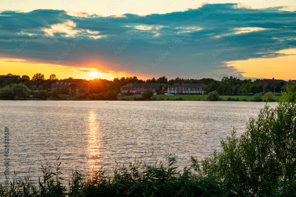 Furzton lake panorama at sunset in Milton Keynes. England	
