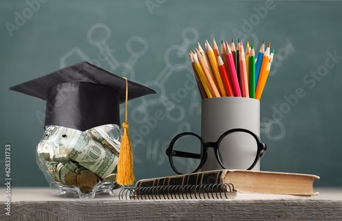 Student Success and education investment concept, coins and books