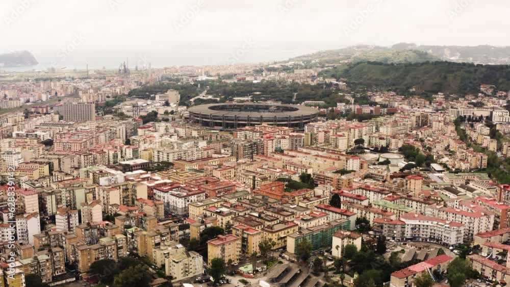 Aerial panorama view showing beautiful city of Naples and Soccer Stadium in background during foggy day, Italy - Bay of Naples in backdrop Aerial panorama view showing beautiful city of Naples and Soccer Stadium in background during foggy day, Italy - Bay of Naples in backdrop