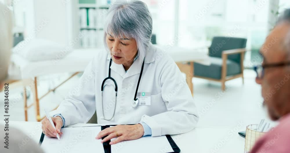 Doctor, woman and meeting couple with notes in clinic for assessment, test results or healthcare insurance. Mature asian therapist consulting patients for documents, medical history or surgery advice Doctor, woman and meeting couple with notes in clinic for assessment, test results or healthcare insurance. Mature asian therapist consulting patients for documents, medical history or surgery advice