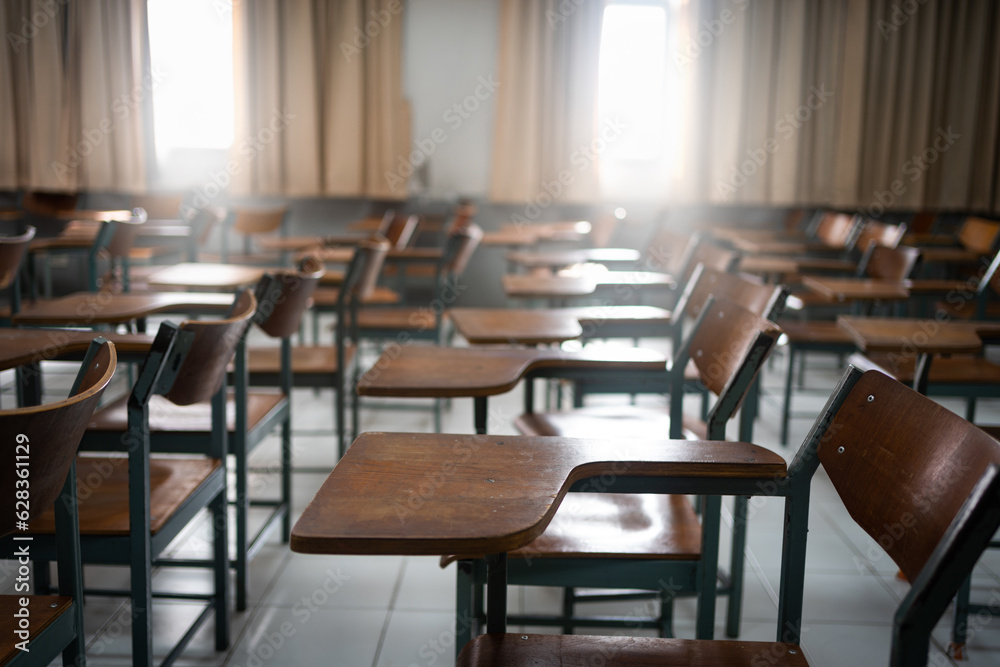 Empty classroom with vintage tone wooden chairs. Back to school concept