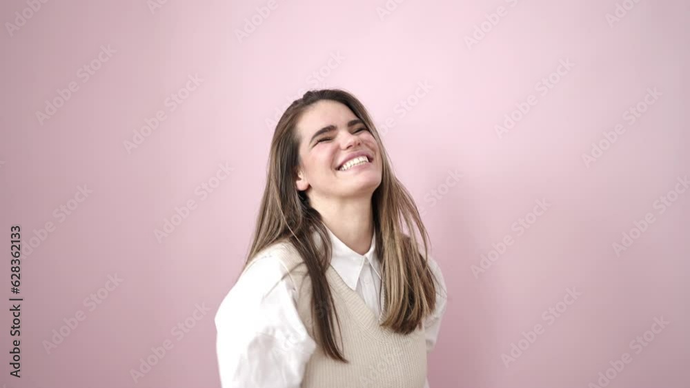 Young beautiful hispanic woman smiling and dancing over isolated pink background Young beautiful hispanic woman smiling and dancing over isolated pink background