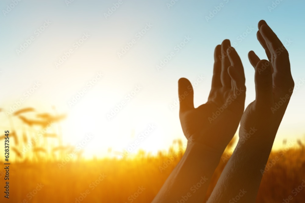 Human hands worship Praying on sky background