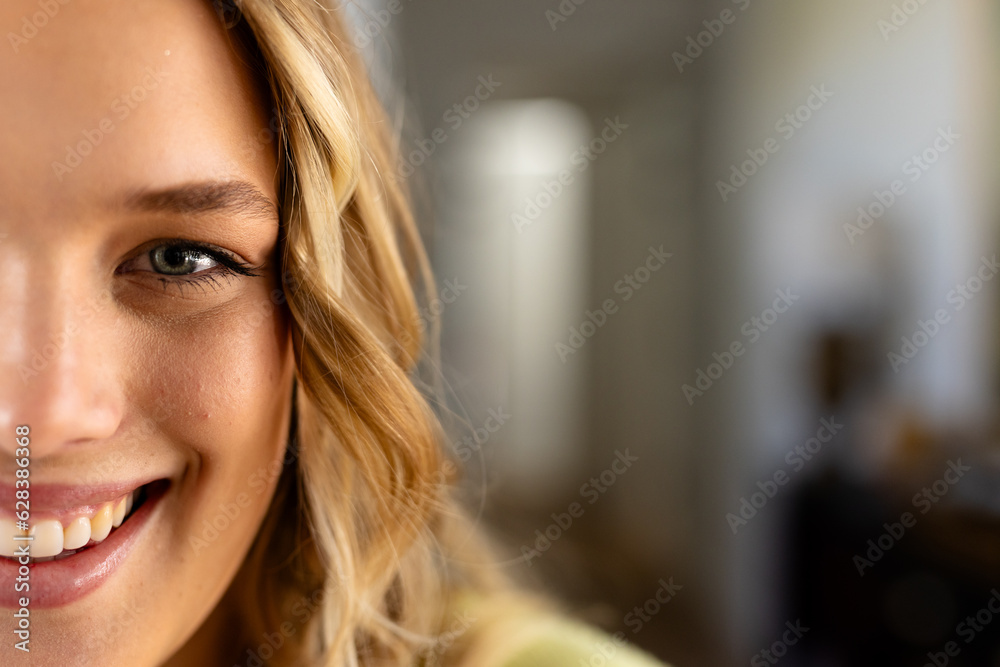 Portrait of happy caucasian woman with long blond hair at home, copy space Portrait of happy caucasian woman with long blond hair at home, copy space