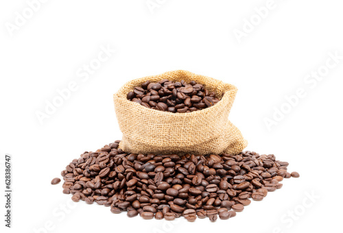 Heap of brown roasted coffee beans in burlap bags isolated on white background. fresh coffee beans concept