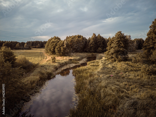 The small winding river Grabia in central Poland. photo