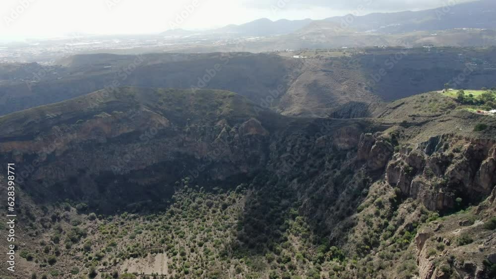 Caldera Bandama, Gran Canaria: aerial view flying over the crater of this geological formation of the Canary Islands. Caldera Bandama, Gran Canaria: aerial view flying over the crater of this geological formation of the Canary Islands.