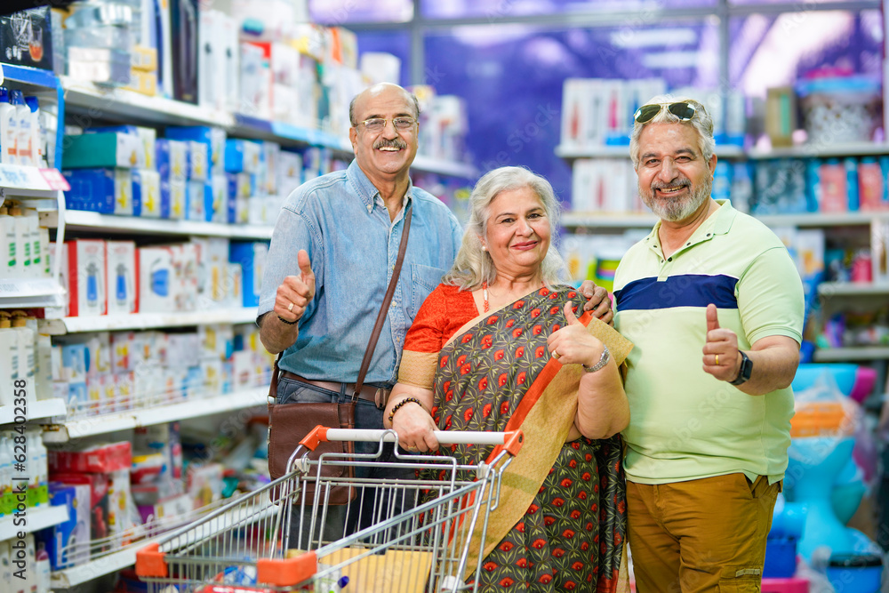 Indian seniors group shopping together at super market.