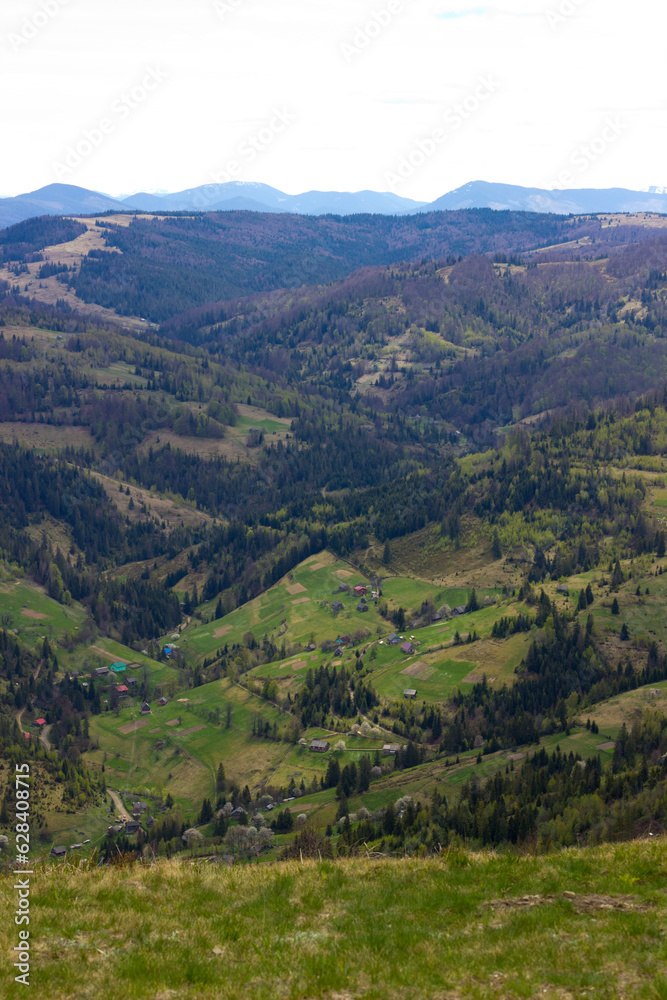 Beautiful ukrainian landscape with mountains and valley on spring.Aerial view from mountain top in Slavske,Lviv region.Image for calendar design,postcard,wallpaper,wall canvas