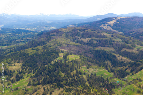 Beautiful ukrainian landscape with mountains and valley on spring.Aerial view from mountain top in Slavske,Lviv region.Image for calendar design,postcard,wallpaper,wall canvas © Maryna